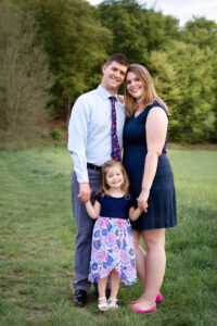 Melissa Driggers, Northern Virginia photographer, with her husband and daughter in a field