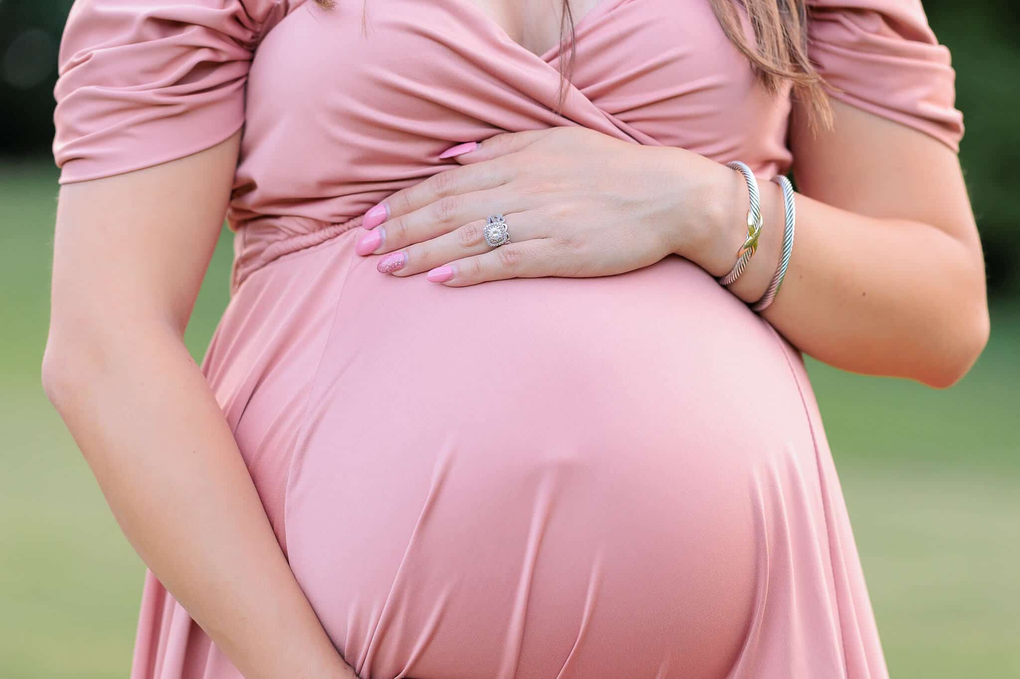 A blog post about PeekABoo 3D Ultrasound in Fredericksburg, Virginia featuring a photo of a woman's pregnant belly in a pink dress.