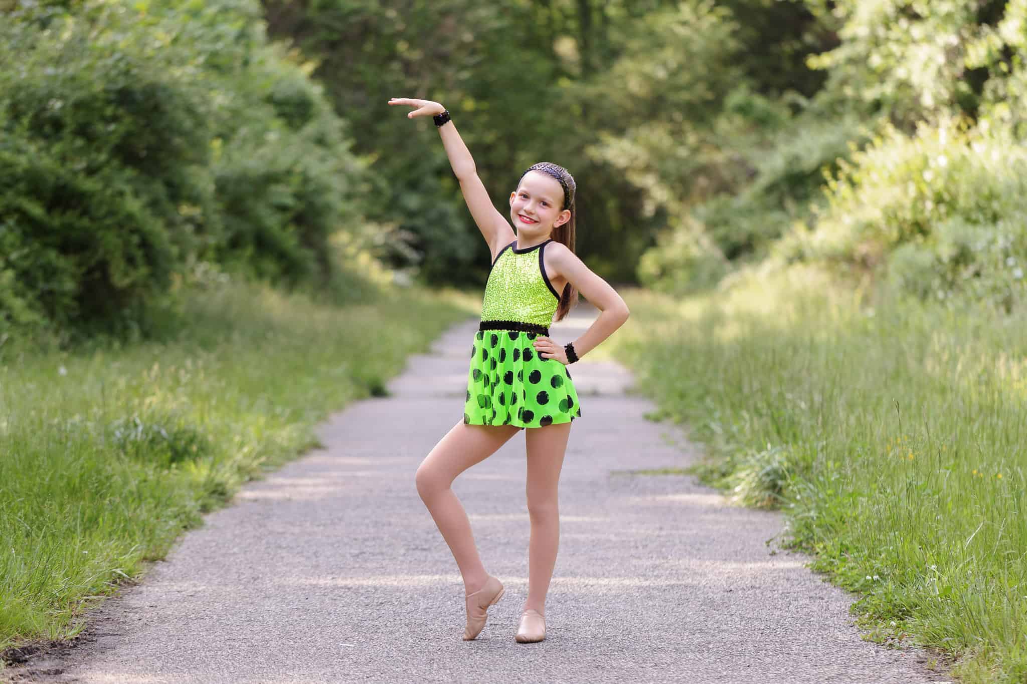 A young girl posing in her jazz outfit for a photography session and featured in a blog about Northern Virginia dance studios.