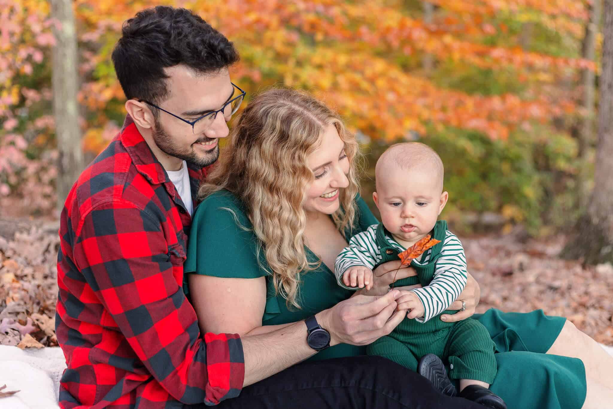 A couple with their baby featured on a blog about Northern Virginia montessori schools.