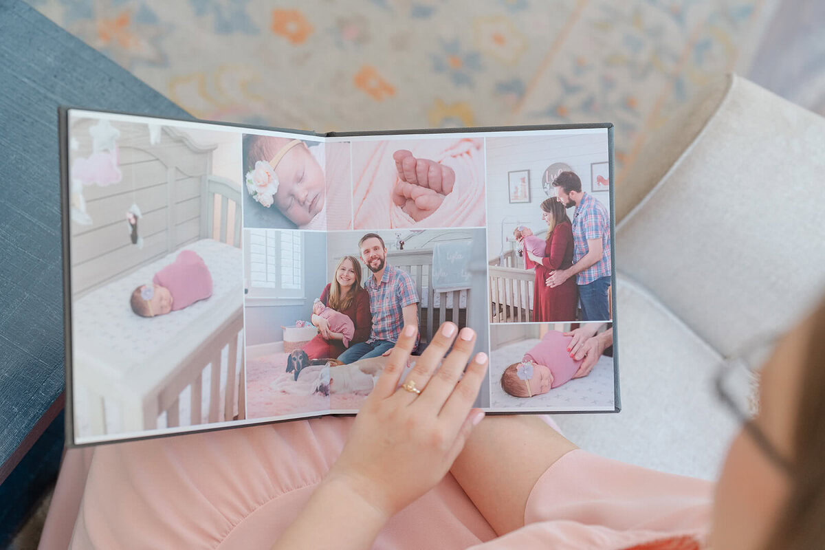 Open layflat photo book filled with newborn and family photos, one of many family photo gift ideas